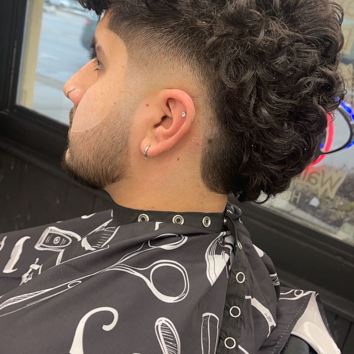 Men's curly hair fade cut