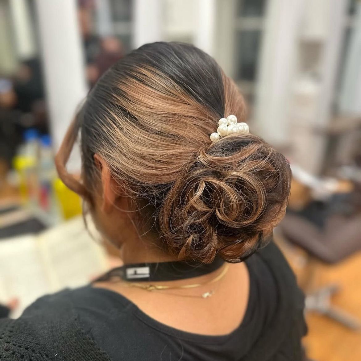 Elegant updo with pearl accessories